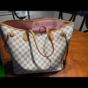 White checkered Never Full style tote. Pink inside.